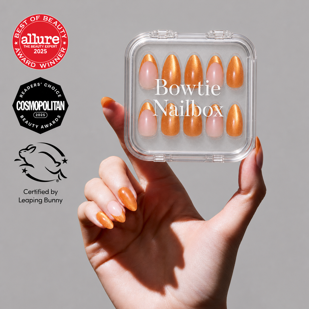 Orange Pop press-on nails on hand - lifestyle photo, polka dot finish