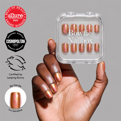 Papaya Chrome press-on nails on hand - lifestyle photo, cat-eye velvet finish