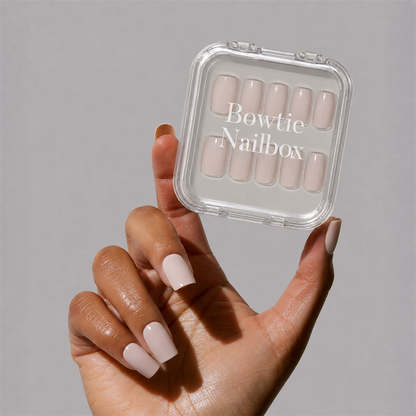 Bare Bliss press-on nails on hand - lifestyle photo, soft neutral finish