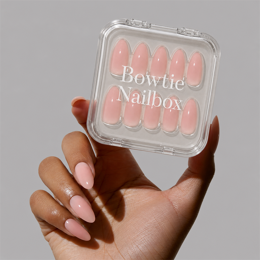 Sheer Peach press-on nails on hand - lifestyle photo, jelly glaze finish