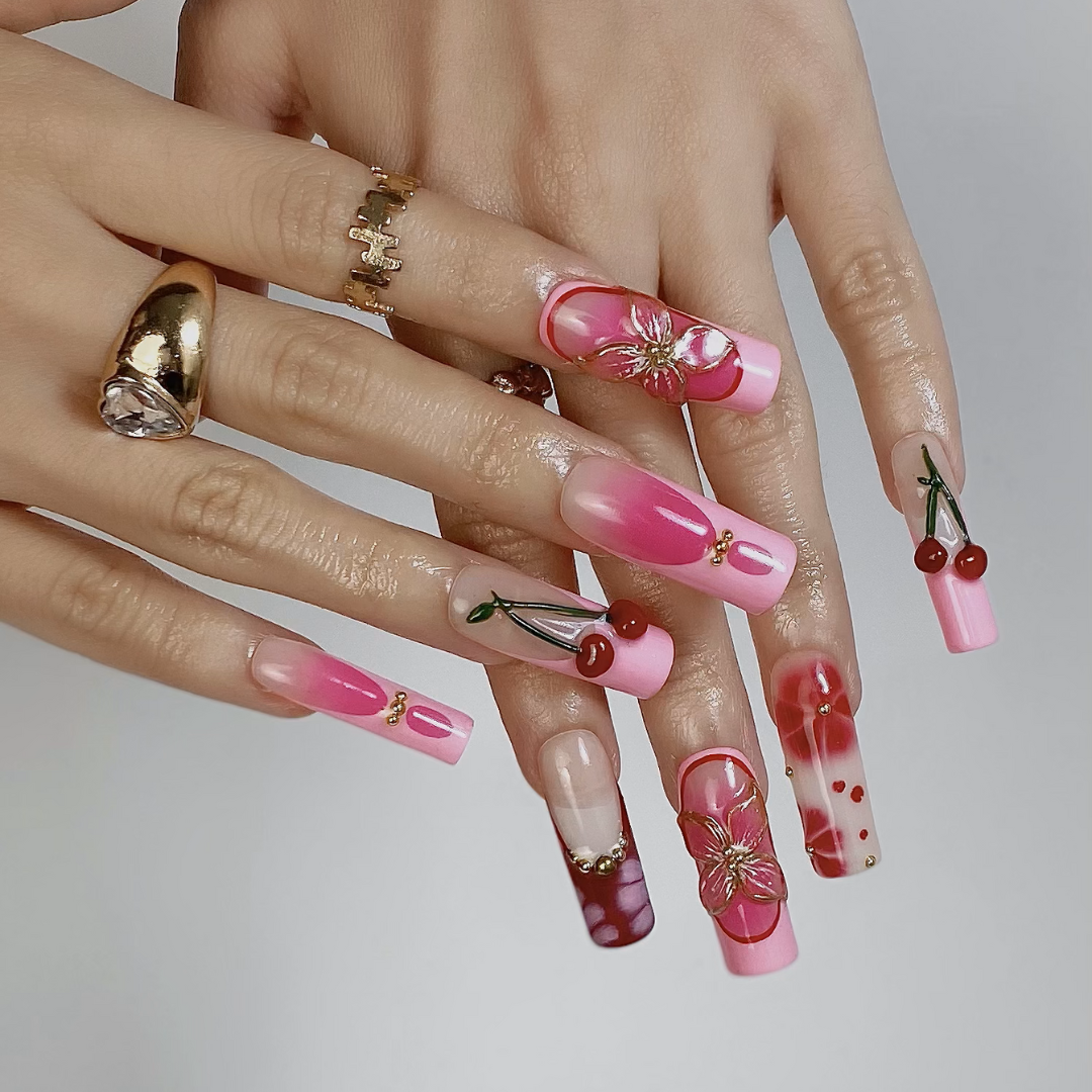 Charm Bloom press-on nails on hand - lifestyle photo, floral finish