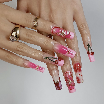 Charm Bloom press-on nails on hand - lifestyle photo, floral finish