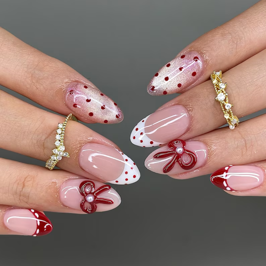 Bow Blush polka dot press-on nails - almond shape, front view