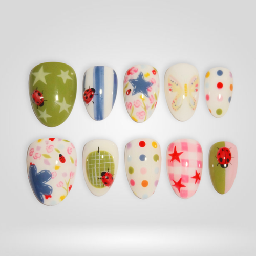 Play Dot butter yellow press-on nails - almond shape, front view