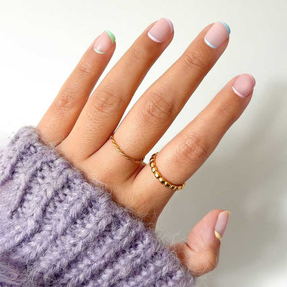 Tutti Frutti french tip press-on nails - round shape, front view