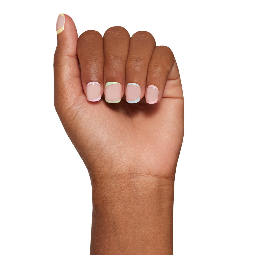 Tutti Frutti press-on nails on hand - lifestyle photo, french tip finish