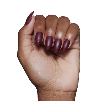 Merlot press-on nails on hand - lifestyle photo, french tip finish