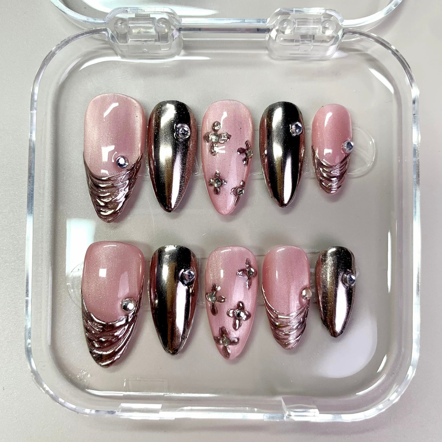 Blush Chrome press-on nails on hand - lifestyle photo, 3d sculptural finish