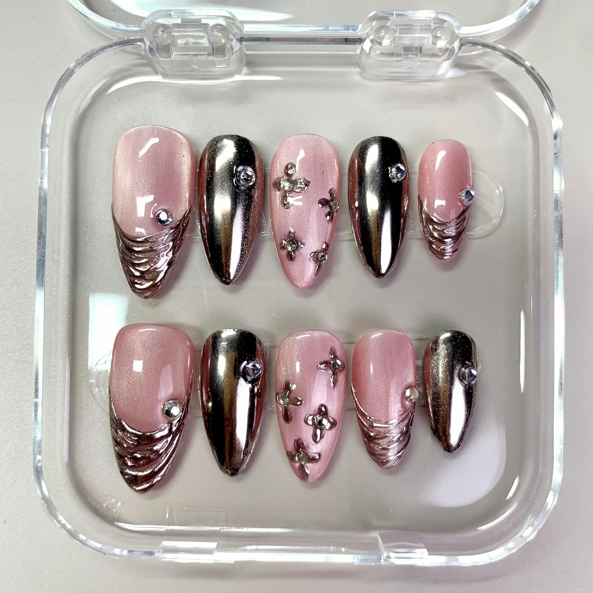 Blush Chrome press-on nails on hand - lifestyle photo, 3d sculptural finish