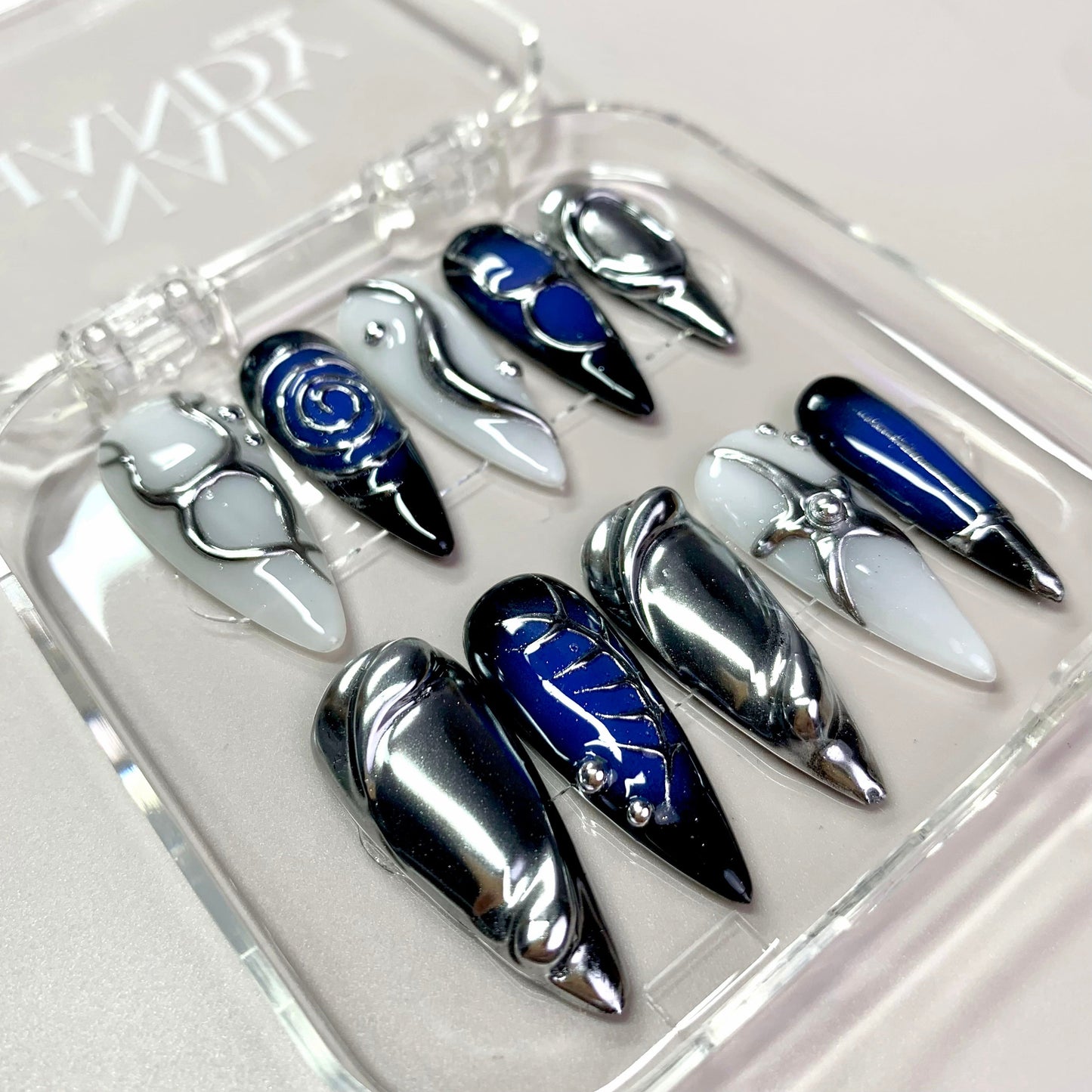 Futuristic Space press-on nails on hand - lifestyle photo, milky cloud dancer finish