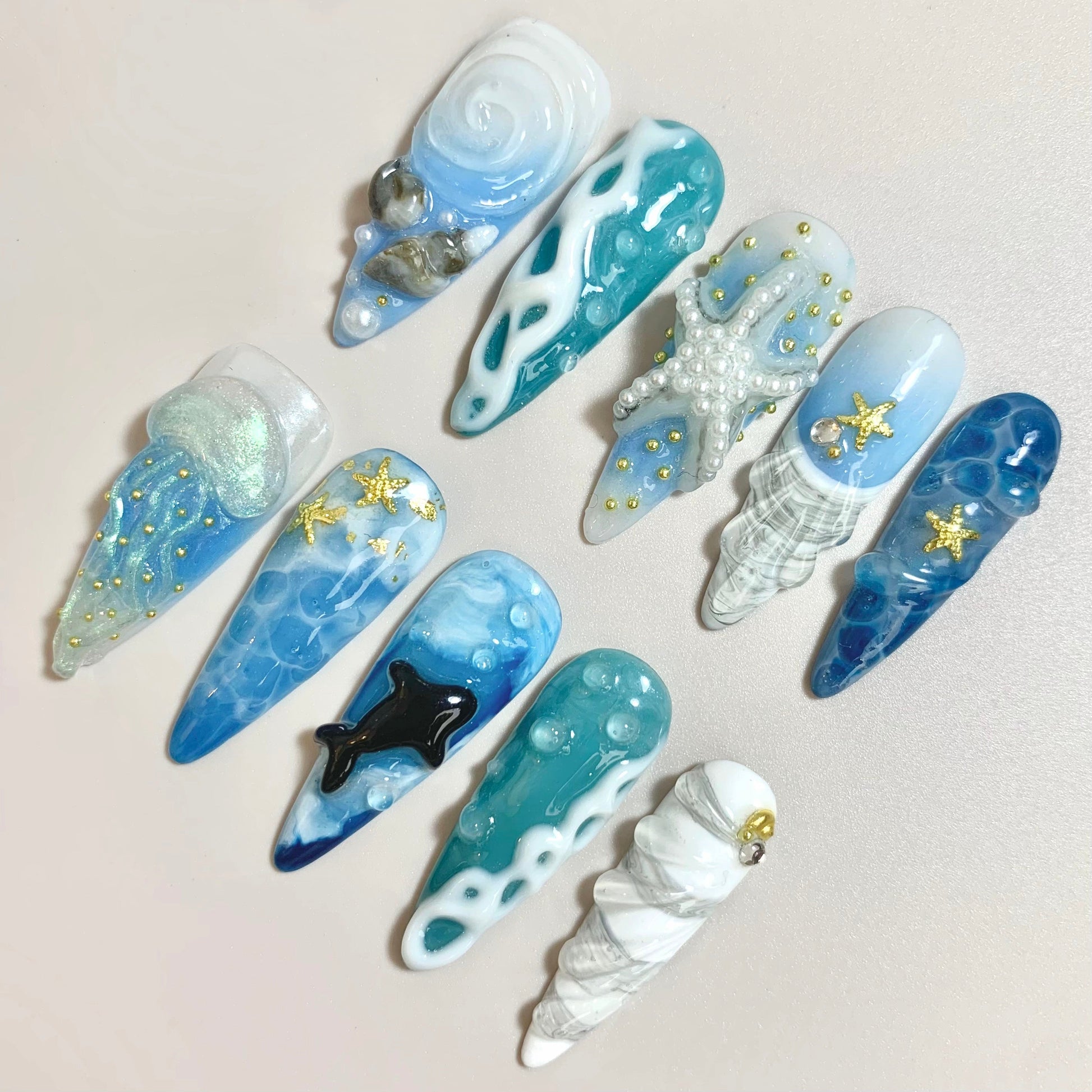 Ocean Breeze press-on nails on hand - lifestyle photo, 3d sculptural finish