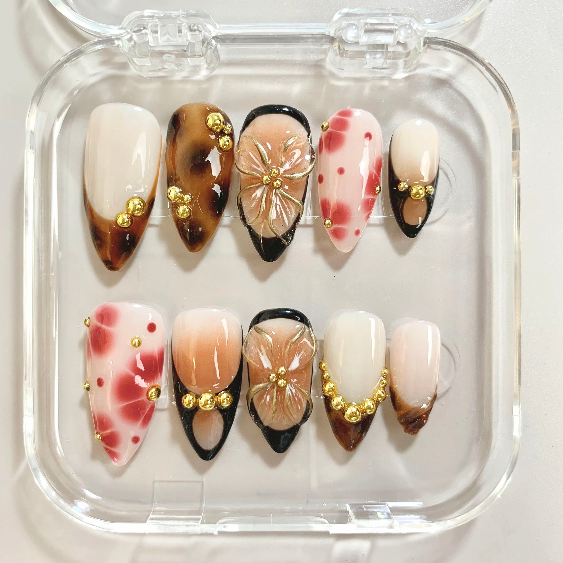 Golden Wild press-on nails on hand - lifestyle photo, french tip finish