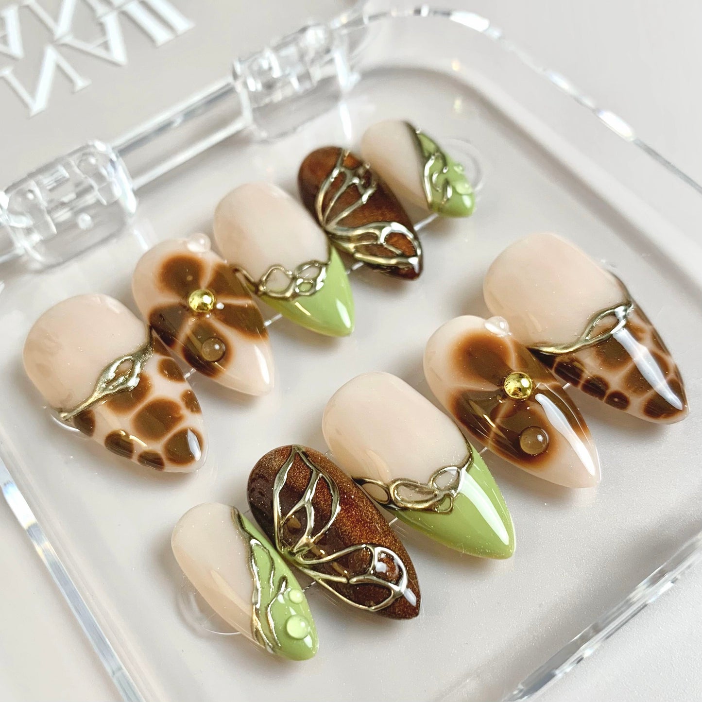 Earthy Elegance press-on nails on hand - lifestyle photo, cat-eye velvet finish
