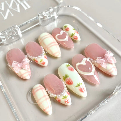 Sweet Strawberry press-on nails on hand - lifestyle photo, milky cloud dancer finish