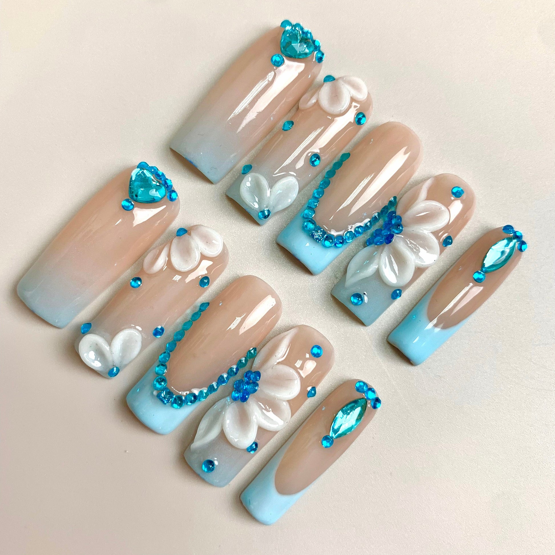 Frosted Flower press-on nails on hand - lifestyle photo, milky cloud dancer finish