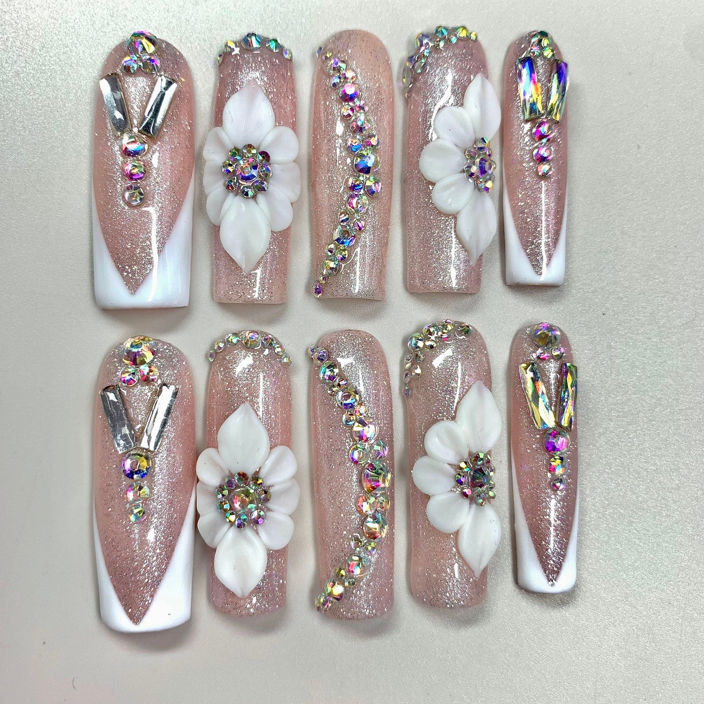 Bloom Luxe press-on nails on hand - lifestyle photo, milky cloud dancer finish