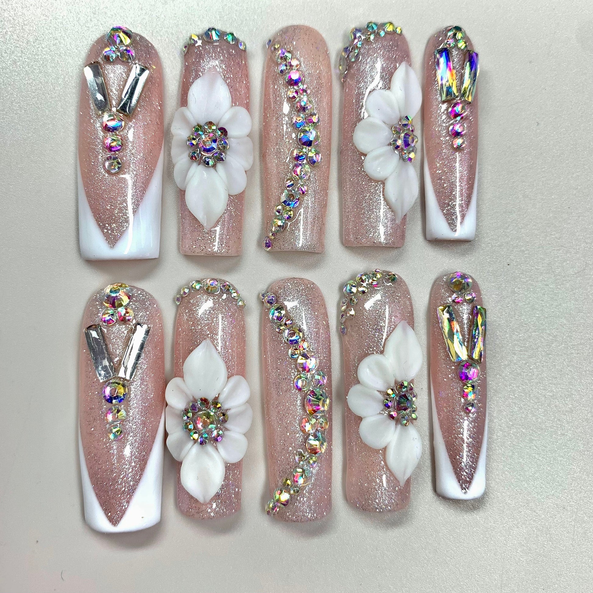 Bloom Luxe press-on nails on hand - lifestyle photo, milky cloud dancer finish