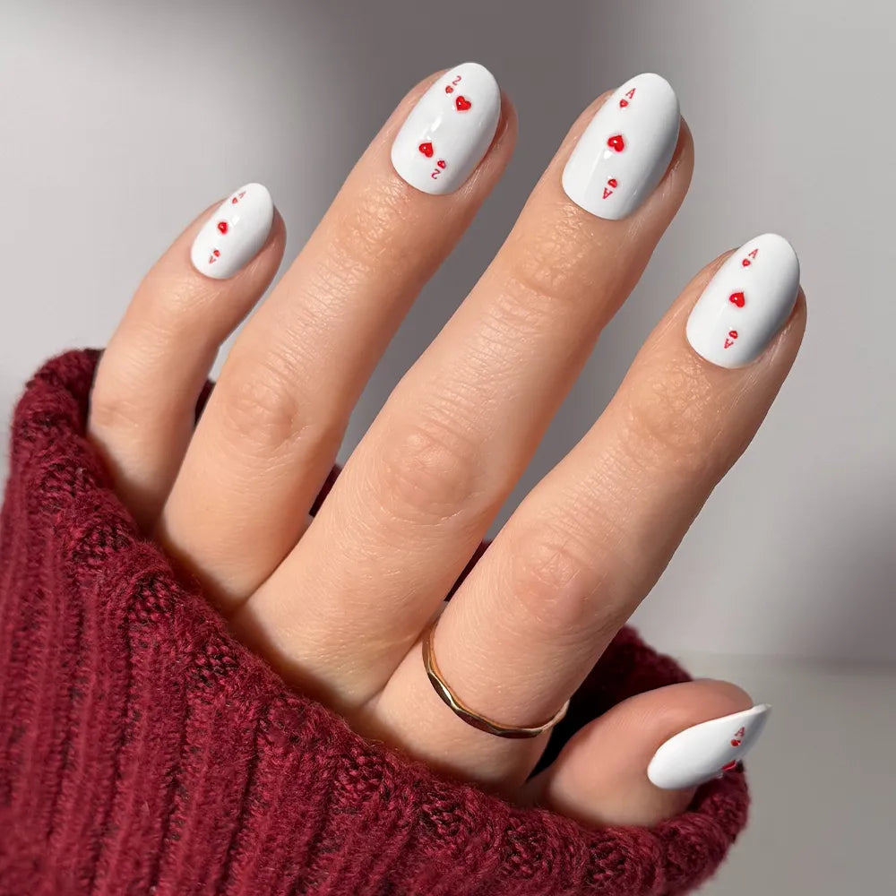 Ace of Hearts milky cloud dancer press-on nails - oval shape, front view