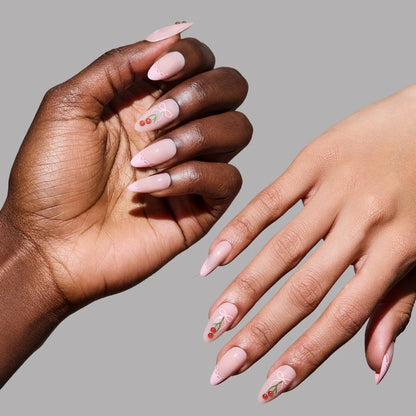 Cherry Bow press-on nails on hand - lifestyle photo, french tip finish