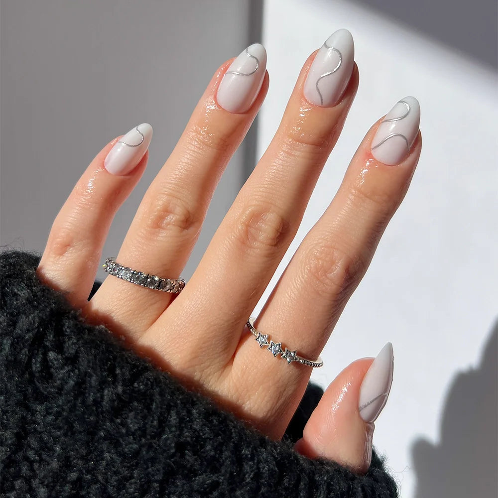 Silent Night milky cloud dancer press-on nails - almond shape, front view