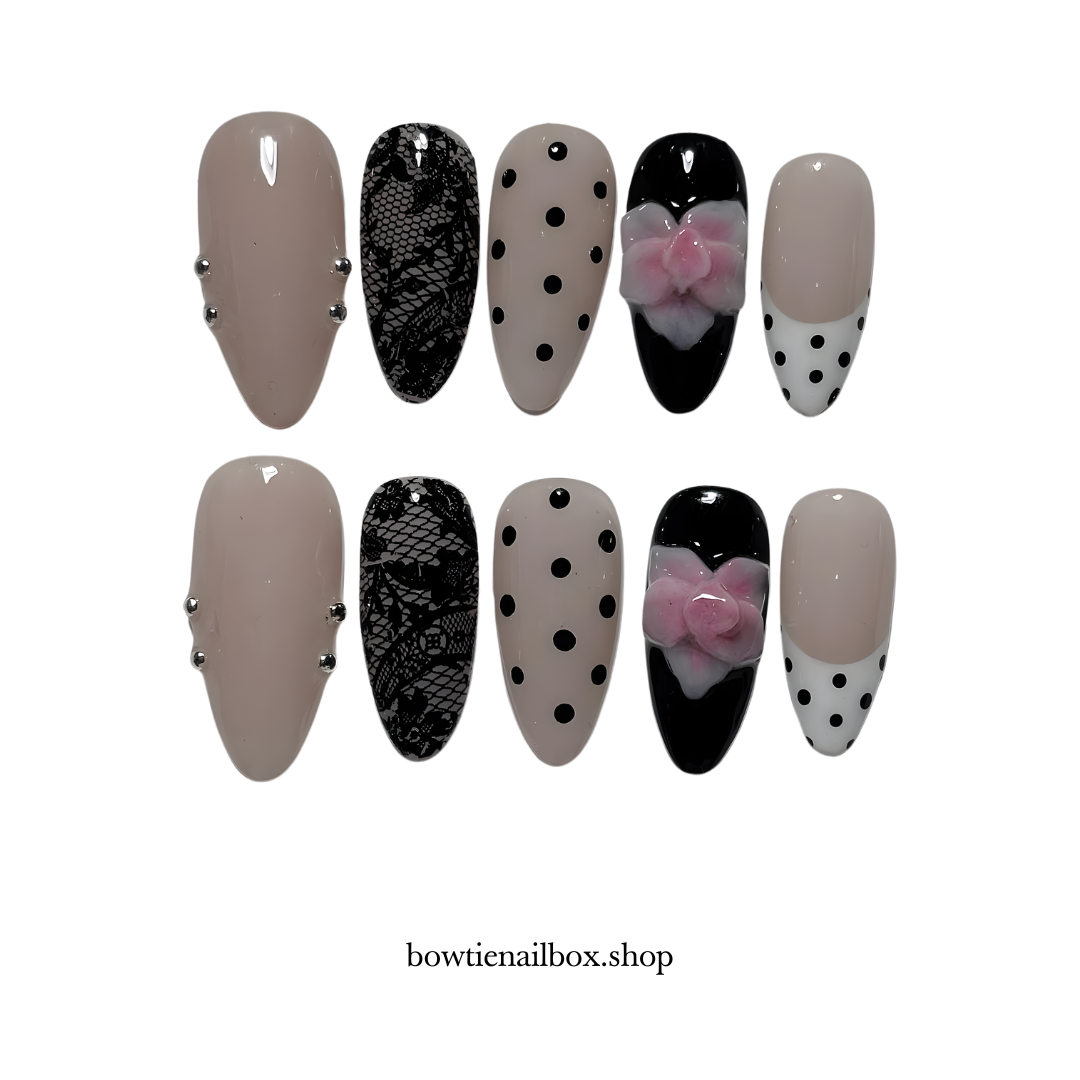 NOIR BLOOM polka dot press-on nails - almond shape, front view