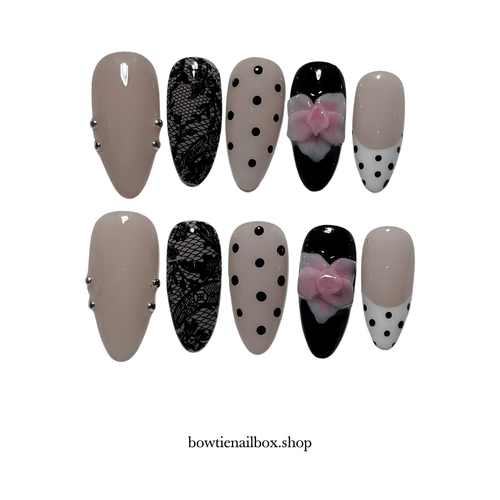 NOIR BLOOM polka dot press-on nails - almond shape, front view