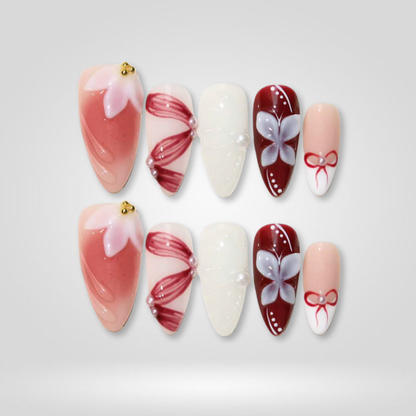 Blush Ribbon seasonal press-on nails - almond shape, front view