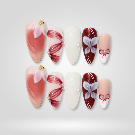 Blush Ribbon seasonal press-on nails - almond shape, front view