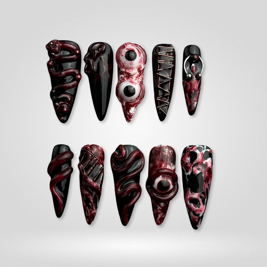 Dark Enchantment press-on nails on hand - lifestyle photo, floral finish