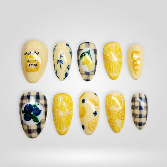 Lemon Story butter yellow press-on nails - almond shape, front view