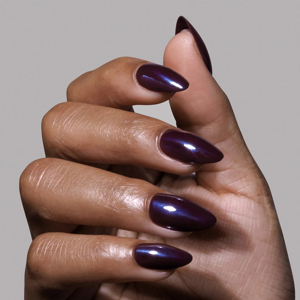 Burgundy Chrome press-on nails on hand - lifestyle photo, cat-eye velvet finish