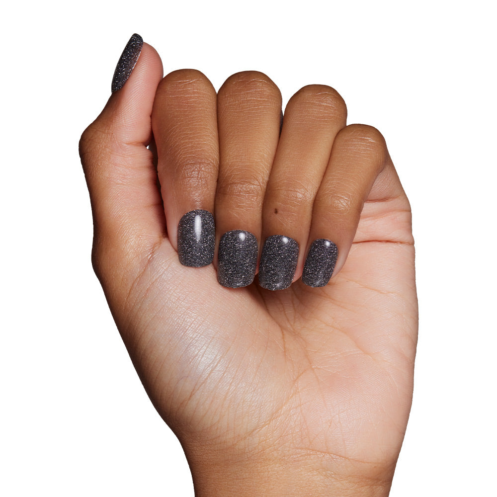 Cosmic press-on nails on hand - lifestyle photo, pearl-shift finish