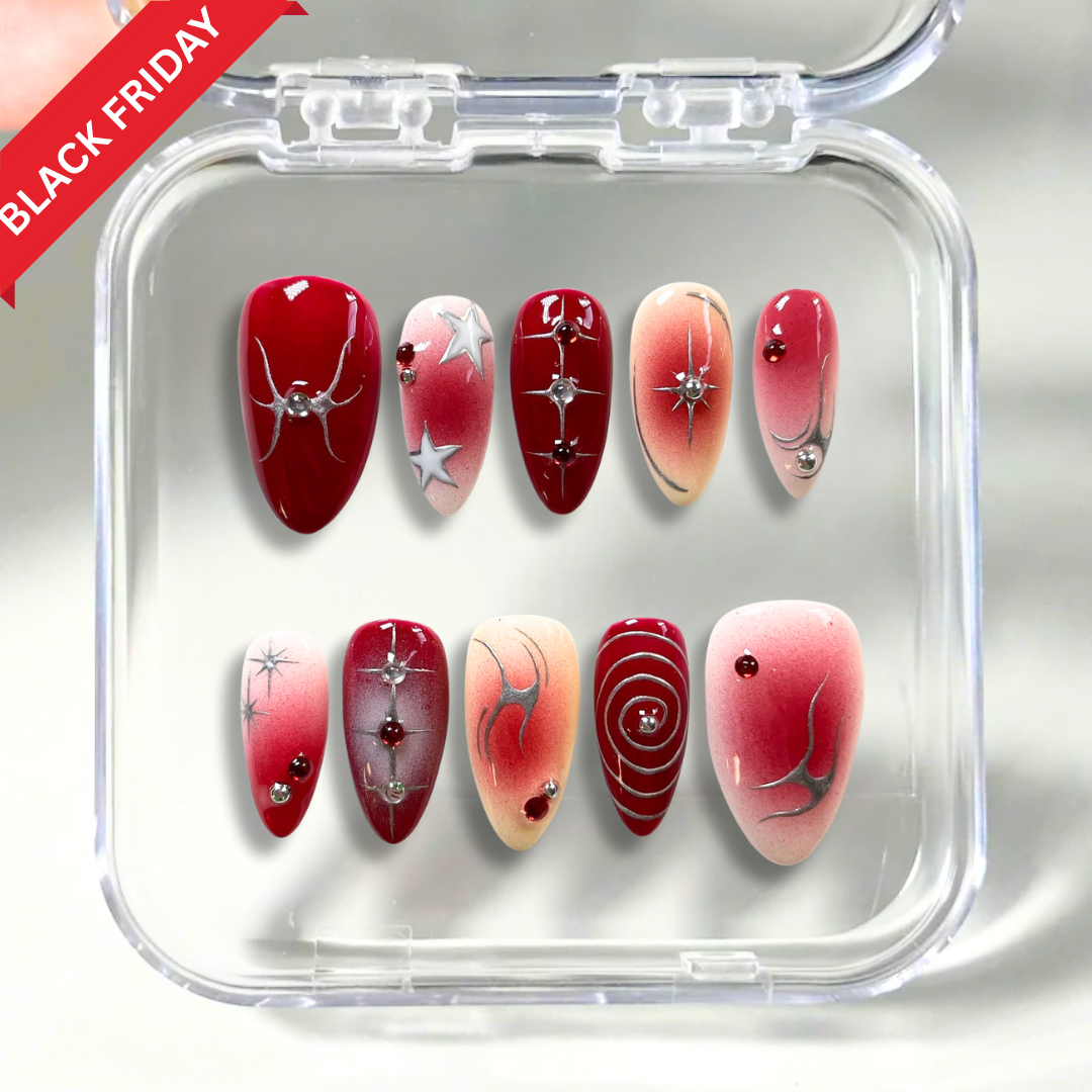 Crimson Orbit press-on nails on hand - lifestyle photo, 3d sculptural finish