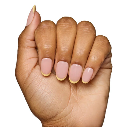 French Butter press-on nails on hand - lifestyle photo, butter yellow finish