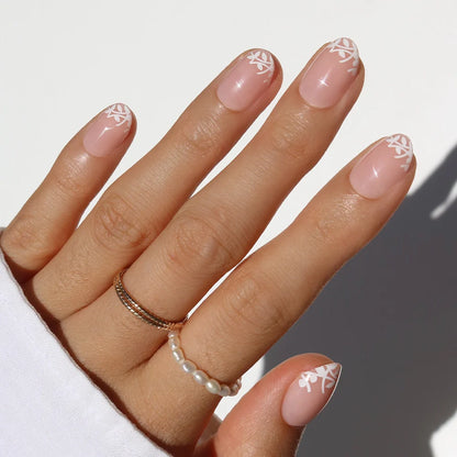 Love Preserved milky cloud dancer press-on nails - oval shape, front view