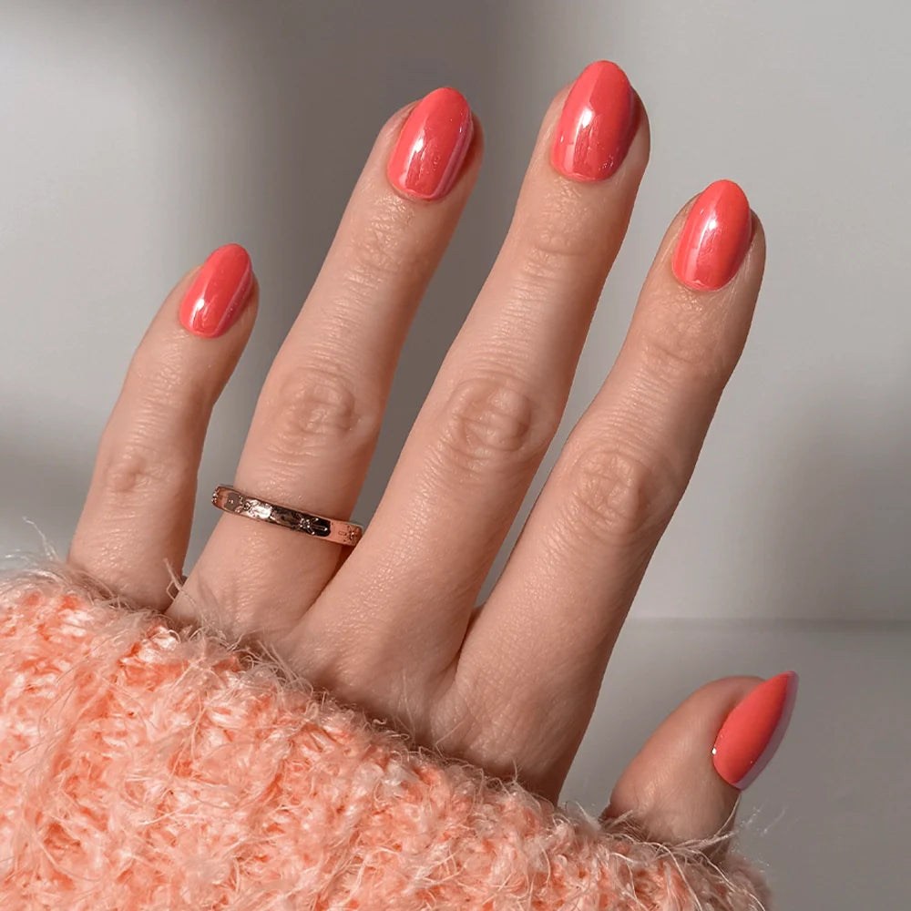 Lush Coral watercolor aura press-on nails - oval shape, front view