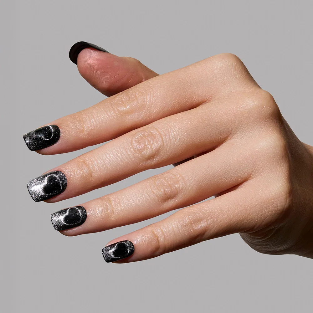 Midnight Romance press-on nails on hand - lifestyle photo, cat-eye velvet finish