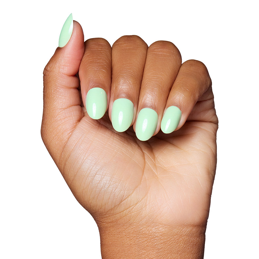Mint Green press-on nails on hand - lifestyle photo, floral finish