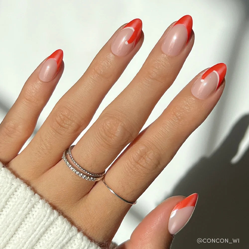 Mrs. Claus french tip press-on nails - almond shape, front view