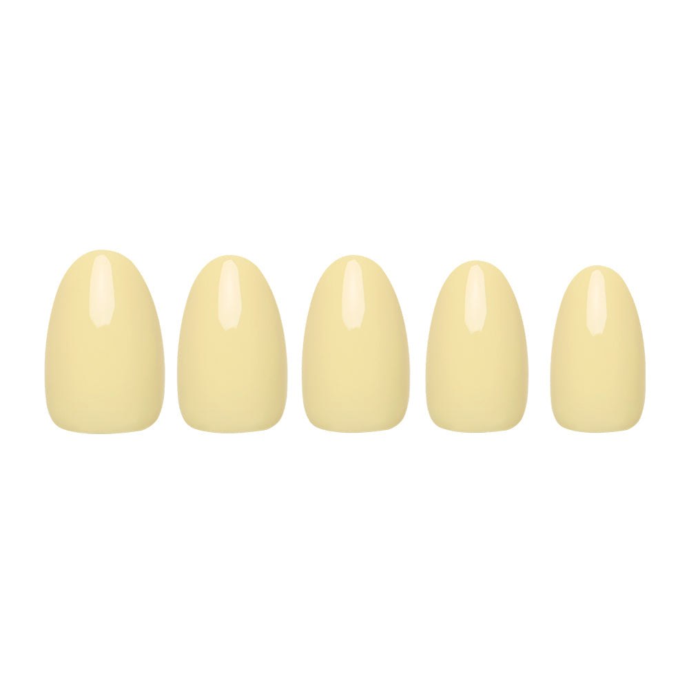 Pastel Yellow press-on nails on hand - lifestyle photo, butter yellow finish