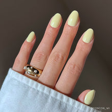 Pastel Yellow butter yellow press-on nails - oval shape, front view