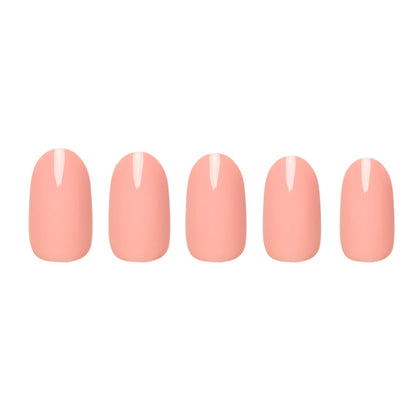 Peach Coral press-on nails on hand - lifestyle photo, pastel finish