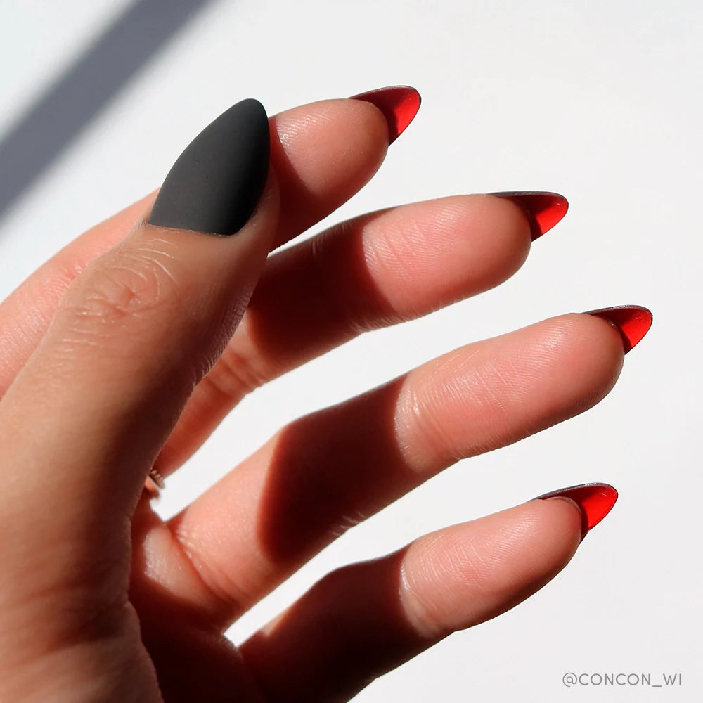 Red Bottom press-on nails on hand - lifestyle photo, cat-eye velvet finish