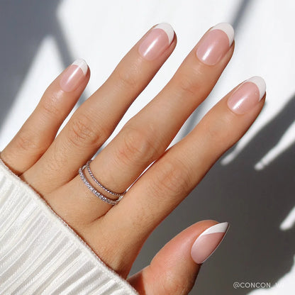 She's a Pearl milky cloud dancer press-on nails - round shape, front view