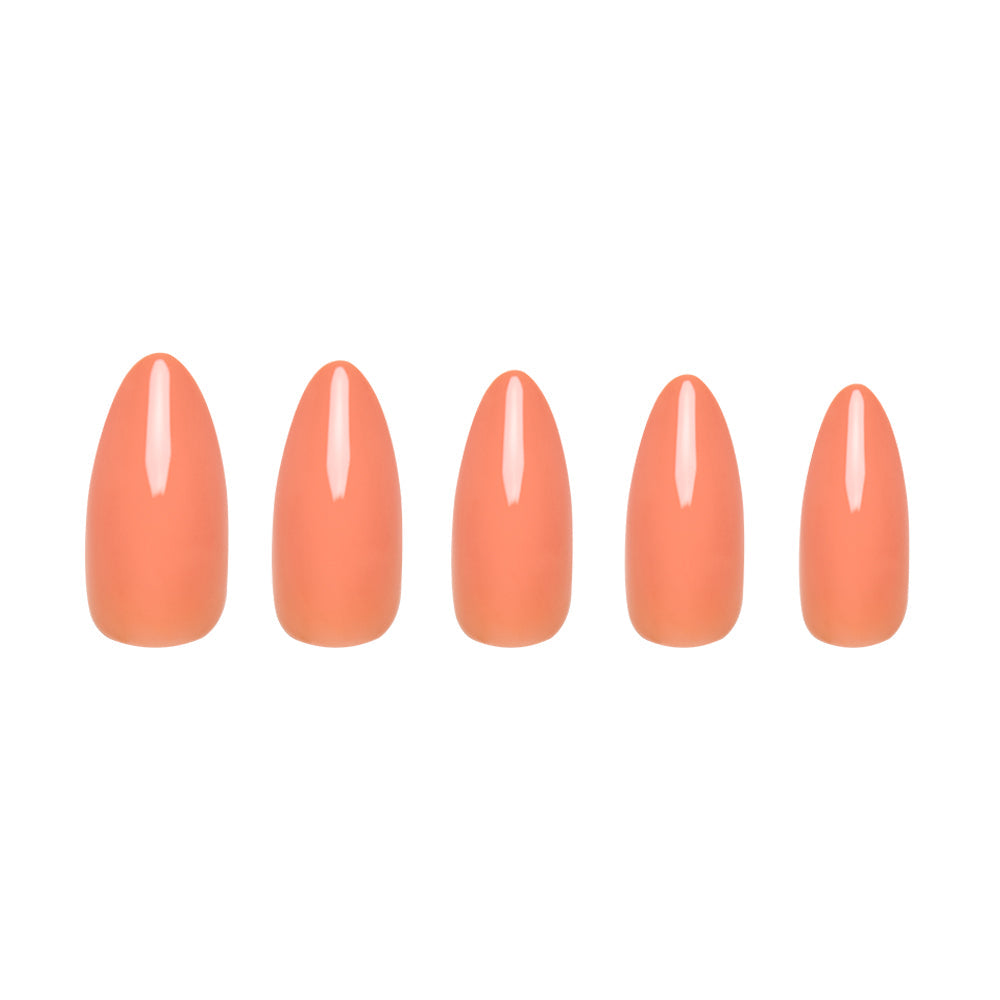 Soft Tangerine press-on nails on hand - lifestyle photo, pastel finish