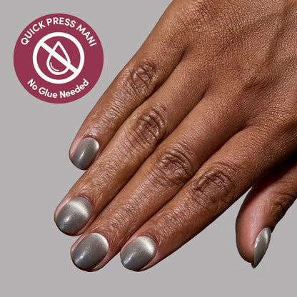 Sparkly Moss press-on nails on hand - lifestyle photo, cat-eye velvet finish