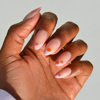 Strawberry Bits french tip press-on nails - almond shape, front view