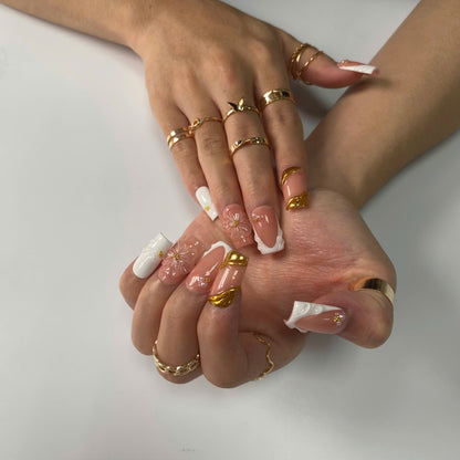 Ivory Grace press-on nails on hand - lifestyle photo, milky cloud dancer finish