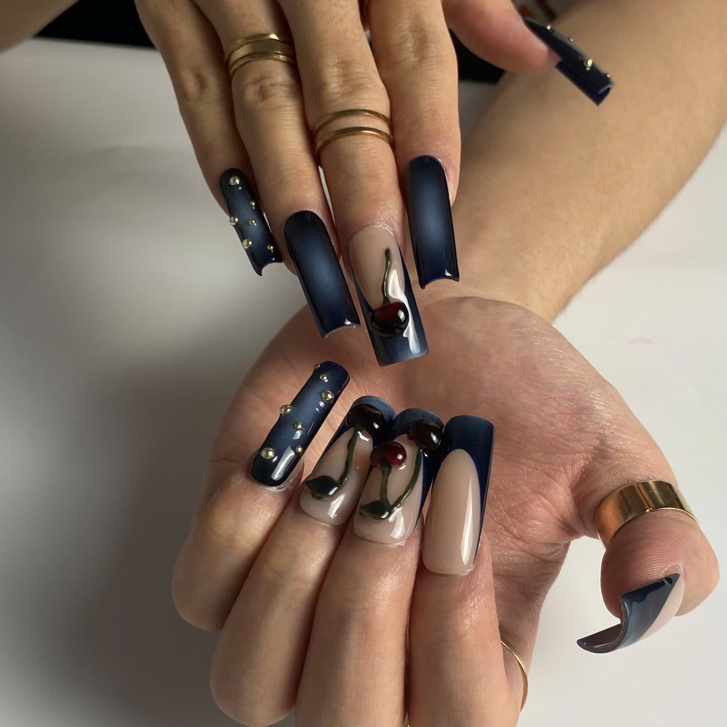 Midnight Cherry press-on nails on hand - lifestyle photo, 3d sculptural finish