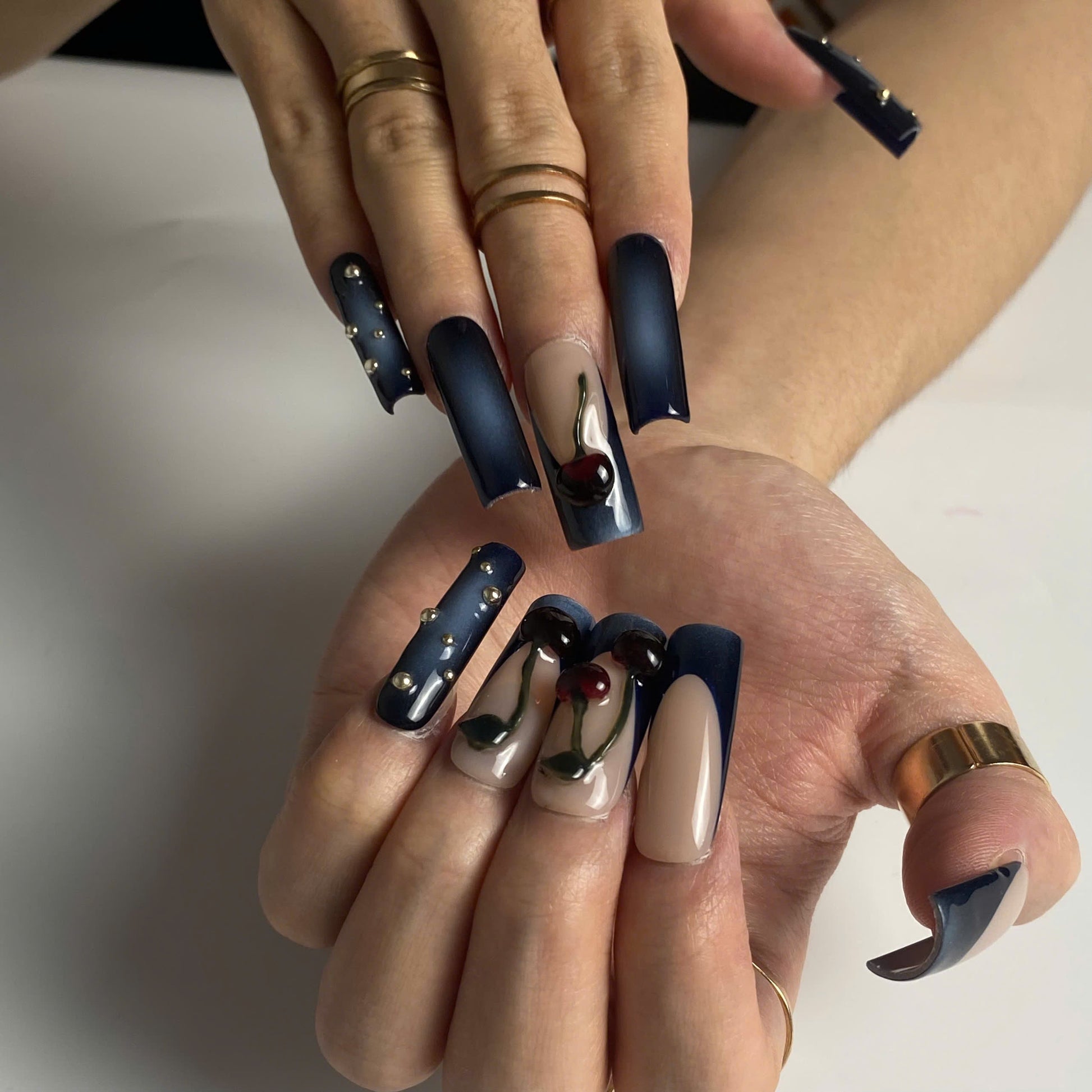 Midnight Cherry press-on nails on hand - lifestyle photo, 3d sculptural finish